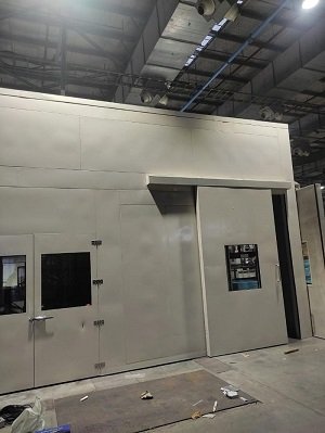 Acoustic Enclosure For Fin Press With Pneumatic Sliding Door